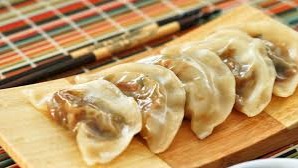 Dumplings Dumpling is a broad classification for a dish that consists of pieces of dough (made from a variety of starch sources) wrapped around a filling or of ...
